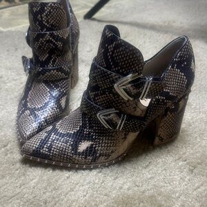 Gianni Bini Snake Print Heeled Boots - Black and Brown